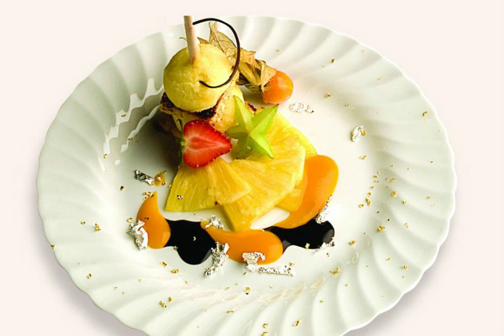 Chef Antonio Marangi tops his panettone with pineapple sherbet, fruit, mango coulis and chocolate dip. Credit: Courtesy of Loison